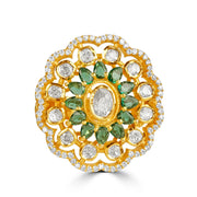Silver Gold plated ring with green gemstones and diamonds on a white background